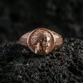 Load image into Gallery viewer, Silver Venus ring in a rose gold plated finish on volcanic rock, feminine goddess profile engraving with classical Greek pattern, dark studio close-up