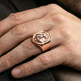 Load image into Gallery viewer, Anubis signet ring in a rose gold plated finish worn on finger, sculpted Egyptian god emblem and modern frame, lifestyle close-up