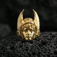 Load image into Gallery viewer, Greek Hermes ring in a gold plated finish on volcanic rock, winged helmet and classic deity face carving, luxury macro product photo