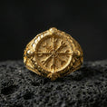 Load image into Gallery viewer, Viking Vegvisir signet ring in a gold plated finish on volcanic rock, bold Icelandic compass symbol engraving, premium macro shot