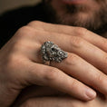 Load image into Gallery viewer, Oxidized sterling silver Zeus ring worn on finger, bold Greek mythology design with laurel wreath crown, masculine lifestyle hand shot