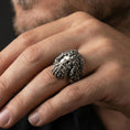 Load image into Gallery viewer, Oxidized sterling silver Zeus head ring worn on finger, bold Greek mythology design with detailed facial expression, masculine lifestyle hand shot
