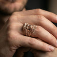 Load image into Gallery viewer, Rose gold plated Zeus ring on finger featuring ornate sculpted face, refined lifestyle jewelry wear shot
