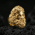 Load image into Gallery viewer, Gold plated Zeus signet ring with high-relief Greek god head and intricate hair detailing, premium studio macro on black volcanic rock surface