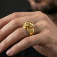 Load image into Gallery viewer, Gold plated Foo Dog signet ring worn on finger, statement guardian lion jewelry inspired by Asian protection symbolism, premium lifestyle close-up