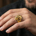 Load image into Gallery viewer, Gold plated werewolf signet ring worn on finger, statement fantasy jewelry inspired by mythological beasts, premium lifestyle close-up