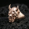 Load image into Gallery viewer, Rose gold plated Oni mask signet ring on black volcanic stone, Japanese Oni demon face ring, bold gothic signet look, high-detail carving
