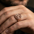 Load image into Gallery viewer, Rose gold plated wolf and dragon ring on a human finger, mythical wolf and dragon design, collectible fantasy ring