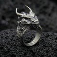 Load image into Gallery viewer, Oxidized sterling silver horned dragon ring on black volcanic stone, detailed dragon head and scales, mythical creature jewelry