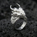 Load image into Gallery viewer, Polished sterling silver horned dragon ring on black volcanic stone, sculpted dragon head with horns, fantasy statement ring