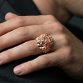 Load image into Gallery viewer, Rose gold plated Medusa head ring worn on a human finger, snake hair relief gorgon motif, mythological accessory