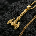 Load image into Gallery viewer, Gold plated Viking labrys axe necklace pendant on black volcanic stone, engraved double-headed axe, braided chain