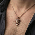 Load image into Gallery viewer, Rose gold plated Statue of Liberty pendant on a human neck, New York City charm, braided chain necklace