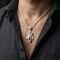 Load image into Gallery viewer, Polished sterling silver Assyrian lamassu pendant on a human neck, Assyrian lamassu talisman necklace, braided chain