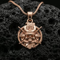 Load image into Gallery viewer, Rose gold plated samurai skull necklace pendant on volcanic stone, shogun-inspired kabuto skull and katana motif