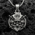Load image into Gallery viewer, Oxidized sterling silver samurai skull necklace pendant on volcanic stone, kabuto helmet and crossed katanas design