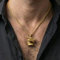 Load image into Gallery viewer, Gold plated dragon pendant necklace worn on neck, premium lifestyle composition, fantasy dragon head centerpiece with sculpted fangs