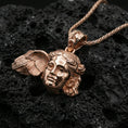 Load image into Gallery viewer, Rose gold plated Hypnos face pendant on matte volcanic stone, detailed classical features and wing element, sharp macro focus