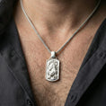 Load image into Gallery viewer, Polished silver zodiac tiger pendant necklace worn on neck, close lifestyle crop, clear tiger engraving and frame detail