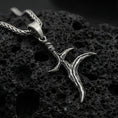 Load image into Gallery viewer, Oxidized sterling silver black knife charm pendant on volcanic rock, Elden Ring inspired dagger necklace, macro product photo