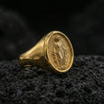 Load image into Gallery viewer, Gold plated Virgin Mary signet ring on dark volcanic rock, oval medallion religious ring, sharp macro detail