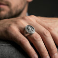 Load image into Gallery viewer, Oxidized sterling silver Virgin Mary signet ring worn on finger, oval religious seal ring, lifestyle close-up
