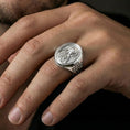 Load image into Gallery viewer, Polished silver Our Lady of Guadalupe oval signet ring worn on finger, glossy Virgin Mary relief, clean lifestyle crop
