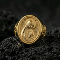 Load image into Gallery viewer, Gold plated Our Lady of Guadalupe signet ring on dark volcanic rock, oval Marian cameo face, premium macro photo