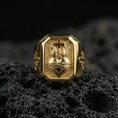 Load image into Gallery viewer, Gold plated cross heart signet ring on dark volcanic rock, sacred heart and cross relief, devotional ring