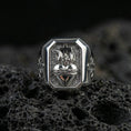 Load image into Gallery viewer, Polished silver cross heart signet ring on porous volcanic stone, sacred heart motif relief, Christian jewelry