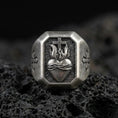 Load image into Gallery viewer, Oxidized sterling silver cross heart signet ring on volcanic rock, sacred heart flame relief, cross side engraving