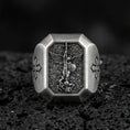 Load image into Gallery viewer, Oxidized sterling silver St Michael archangel signet ring on volcanic rock, winged warrior relief, cross shoulder engravings