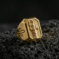 Load image into Gallery viewer, Gold plated St Dominic signet ring on dark volcanic rock, saint with book relief, cross side detail