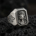 Load image into Gallery viewer, Oxidized sterling silver Jesus Christ signet ring on volcanic rock, crown of thorns portrait relief, cross side engraving
