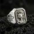 Load image into Gallery viewer, Polished silver Jesus crown of thorns ring on porous volcanic stone, detailed Christ face engraving, Christian signet jewelry
