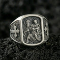 Load image into Gallery viewer, Oxidized sterling silver Saint Christopher ring on volcanic rock, patron of travelers carrying child relief, cross side engraving