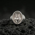 Load image into Gallery viewer, Polished silver Sacred Heart ring on porous volcanic stone, flaming heart engraving with crown of thorns, Christian ring