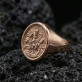 Load image into Gallery viewer, Rose gold plated Saint Mark ring on volcanic stone, evangelist lion signet ring closeup
