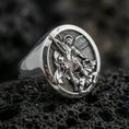 Load image into Gallery viewer, Polished silver St. Michael ring on porous volcanic stone, archangel warrior engraving, religious signet ring
