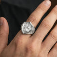 Load image into Gallery viewer, Polished silver Saint George defeating dragon ring worn on finger, detailed knight shield relief, classic statement ring