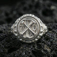Load image into Gallery viewer, Polished silver Chi Rho Alpha Omega signet ring on porous volcanic stone, raised Christian monogram, bold faith ring