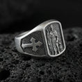 Load image into Gallery viewer, Oxidized 925 sterling silver Saint Roch signet ring on volcanic rock, patron saint relief with dog figure, cross shoulder details