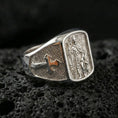 Load image into Gallery viewer, Polished silver Saint Roch signet ring on porous volcanic stone, religious saint medal relief, protection and healing symbol design