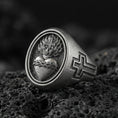 Load image into Gallery viewer, Oxidized 925 sterling silver Sacred Heart signet ring on volcanic rock, flaming heart and cross emblem, Christian devotion jewelry