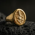 Load image into Gallery viewer, Gold plated Ganesha signet ring on dark volcanic rock, spiritual elephant deity design with raised relief and bold oval face