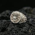 Load image into Gallery viewer, Polished silver Jesus Christ ring on porous volcanic stone, detailed face relief with clean shine and smooth round bezel