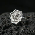 Load image into Gallery viewer, Polished silver Saint Michael signet ring on porous volcanic stone, crisp octagonal bezel and detailed guardian relief