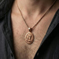 Load image into Gallery viewer, Rose gold plated Medusa coin necklace worn on neck, Greek key medallion with Medusa profile relief and premium vintage look