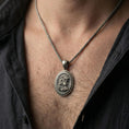 Load image into Gallery viewer, Oxidized 925 sterling silver Medusa coin pendant worn on neck, Greek key border medallion with bold mythological portrait relief