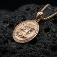 Load image into Gallery viewer, Rose gold plated Medusa necklace on dark volcanic stone, Greek key coin pendant with sculpted Medusa profile and antique-inspired finish